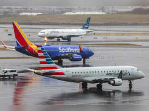 An Airbus A320 passengers aircraft of JetBlue airlines arriving from Tampa is pictured while a Boeing 737 of Southwest airlines arrived from Atlanta and an Airbus A319 arrived from Saint Louis are seen at La Guardia Airport on January 9, 2024.