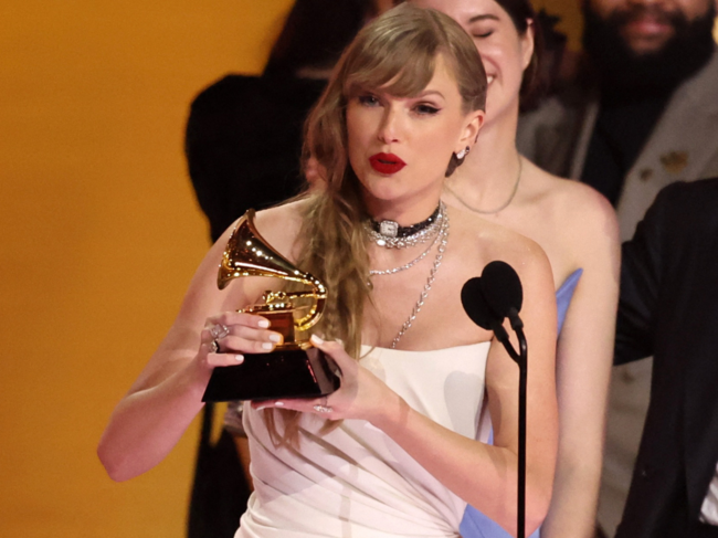 Taylor Swift accepts the award for Album of the Year for Midnights during the 66th Annual Grammy Awards in Los Angeles, California.