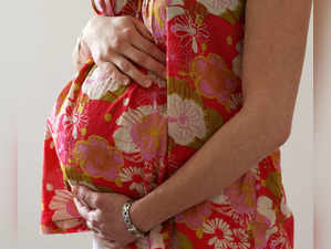 FILE PHOTO: A woman holds her stomach at the last stages of her pregnancy in Bordeaux
