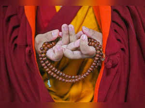 Bodh Gaya: A Tibetan monk takes part in a red crown ceremony by 17th Karmapa tea...