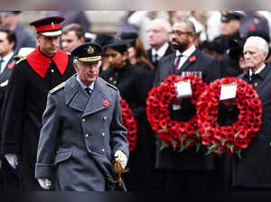 Britain's King Charles III (R) followed by Britain's Prince William, Prince of Wales (L), arrive to attend the Remembrance Sunday ceremony at the Cenotaph on Whitehall in central London on November 12, 2023.