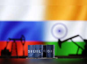 Illustration shows oil pump jack and oil barrels, Russian and Indian flags