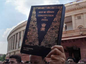 New Delhi: Congress MP Adhir Ranjan Chowdhury, holding a copy of the Constitutio...