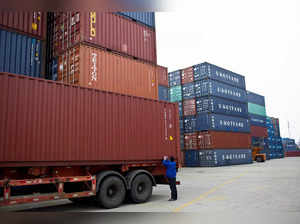 FILE PHOTO: An employee takes notes at a port of Shanghai Free Trade Zone