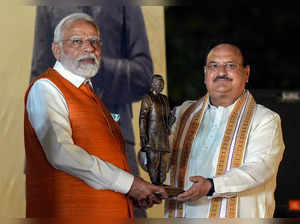 New Delhi: Prime Minister Narendra Modi receives a statue of Deendayal Upadhyaya...