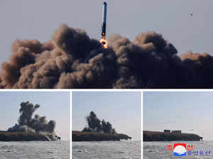 A missile is launched, as the state media report North Korea tested its new land-to-air cruise missiles off its west coast