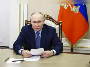 Russian President Vladimir Putin attends a meeting on economic issues via videoc...