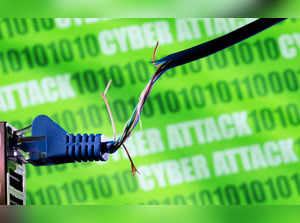 FILE PHOTO: Illustration shows broken Ethernet cable, binary code and words "cyber attack