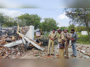 Virudhunagar: Police personnel and others stand near the fireworks factory where...