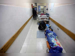 Palestinians wounded in an Israeli strike lie in corridor at Nasser hospital in Khan Younis