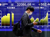 Nikkei edges back from near record high as tech stocks weigh