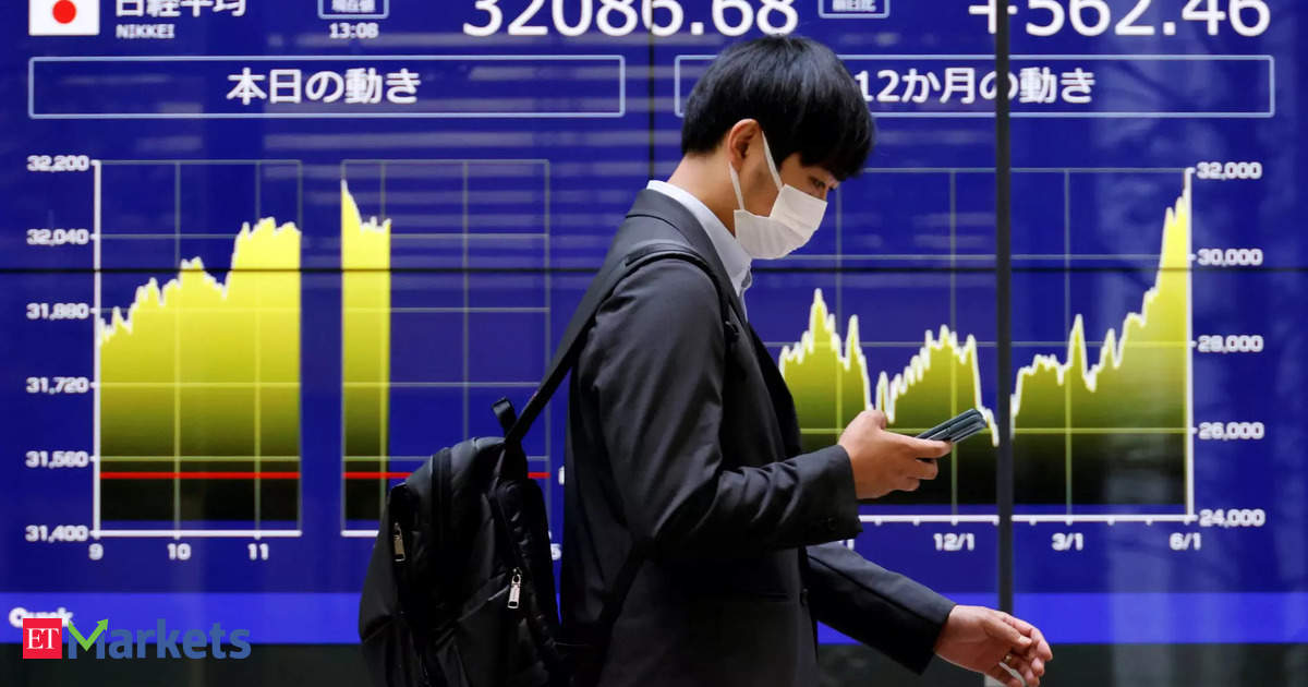Nikkei edges back from near record high as tech stocks weigh