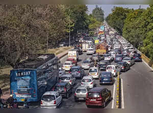 Noida: Vehicles stuck in a traffic jam on a road owing to farmers' protest march...
