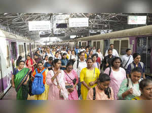 Mumbai: Railway commuters at a station during rush hour ahead of the presentatio...
