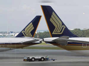 FILE PHOTO: Singapore Airlines (SIA) planes sit on the tarmac in Singapore's Changi Airport