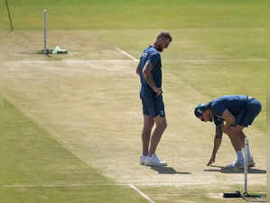 Rajkot: England's captain Ben Stokes and head coach Brendon McCullum inspect the...