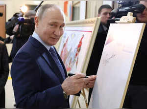 In this pool photograph distributed by Russian state agency Sputnik, Russia's President Vladimir Putin visits the Center for Cultural Development the town of Tsivilsk in the Republic of Chuvashia on February 22, 2024.