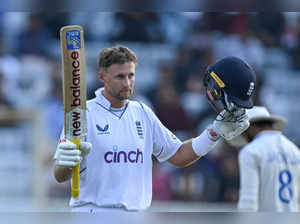 England's Joe Root celebrates after scoring a century (100 runs) during the first day of the fourth Test cricket match between India and England at the Jharkhand State Cricket Association (JSCA) Stadium in Ranchi on February 23, 2024.