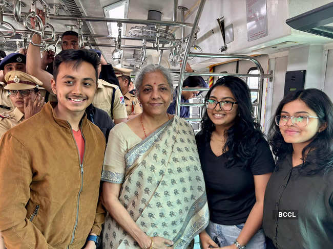 Sitharaman  interacts with commuters while travelling from Ghatkopar to Kalyan in a Mumbai local train