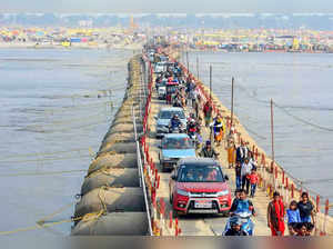 Prayagraj, Feb 16 (ANI): Devotees return after taking a dip in the Ganga river o...