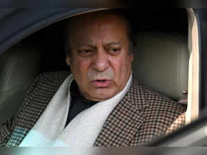 Pakistan's former Prime Minister and leader of the Pakistan Muslim League-Nawaz (PML-N) Nawaz Sharif leaves after casting his ballot to vote outside a polling station during national elections, in Lahore on February 8, 2024.