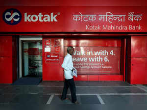 FILE PHOTO: A man walks past the Kotak Mahindra Bank branch in New Delhi