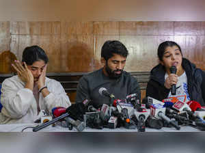 New Delhi: Wrestlers Vinesh Phogat, Bajrang Punia and Sakshi Malik address a pre...