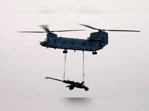 Jaisalmer: Indian Air Force's (IAF) Chinook aircraft carries an artillery during...