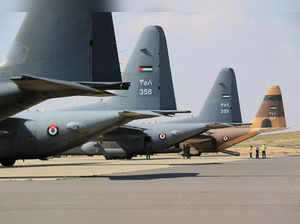 Planes that will airdrop aid to Gaza are lined up in an unidentified airport in Jordan