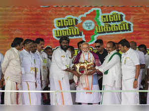 Tiruppur: Prime Minister Narendra Modi being felicitated by Tamil Nadu BJP Presi...