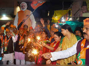 Varanasi: BJP workers celebrate the announcement of Prime Minister Narendra Modi...