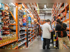 An employee assists a customer at The Home Depot store on February 20, 2024 in Austin, Texas.