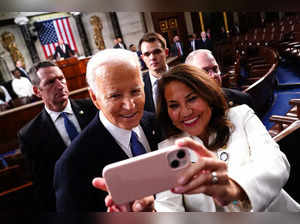 US President Joe Biden takes a selfie as he departs after delivering his third State of the Union address in the House Chamber of the US Capitol in Washington, DC, on March 7, 2024.
