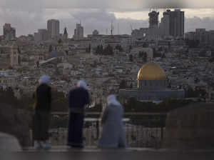 Muslim women visit the Mount of Olives, ahead of Ramadan, overlooking the Dome o...