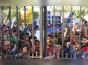 New Delhi: Students of Jamia Millia Islamia university stage a protest after the...