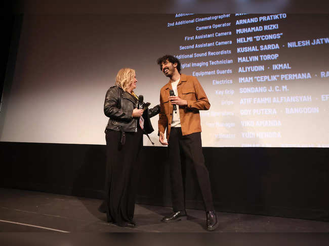 Claudette Godfrey and Dev Patel speak on stage as Universal Pictures Presents The SXSW Premiere Of "Monkey Man" at The Paramount Theater on March 11, 2024 in Austin, Texas.