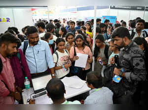 Job seekers attend a walk-in-interview during a state-level job fair organised by India's Karnataka state government at the Palace Grounds in Bengaluru on February 26, 2024.