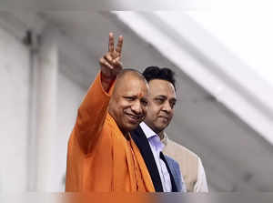 Lucknow: Uttar Pradesh Chief Minister Yogi Adityanath leaves after casting his v...