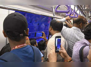 Kolkata: Commuters click pictures aboard the country's first underwater metro tr...