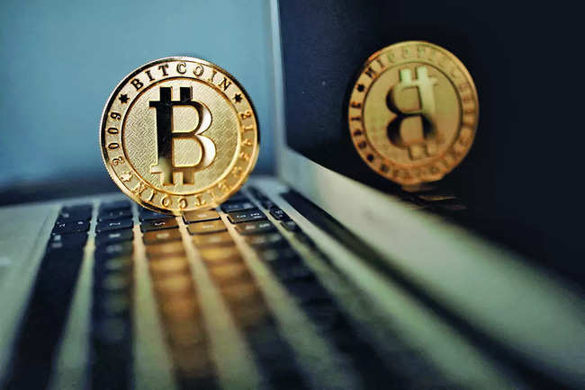 Volatile bitcoin falls from record high as crypto frenzy hits pause
