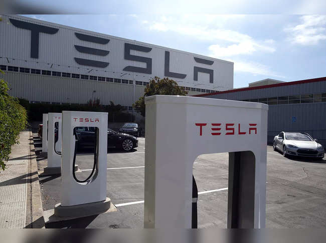 A row of new Tesla Superchargers are seen outside of the Tesla Factory on August 16, 2013 in Fremont, California.