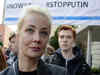 Russians crowd polling stations in apparent protest as Vladimir Putin is set to extend his rule