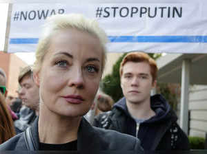 Russians crowd polling stations in apparent protest as Putin is set to extend his rule