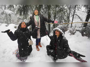 Patnitop: Tourists during snowfall at Patnitop hill station, in Jammu & Kashmir....