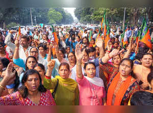 New Delhi: Delhi BJP Mahila Morcha workers raise slogans during a protest outsid...