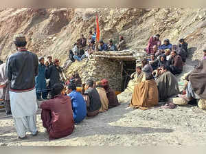 This handout photograph taken on March 20, 2024 and released by Pakistan’s Mines and Minerals Development Department Balochistan shows miners gathered outside a collapsed mine as rescue personnel conduct a search operation for trapped workers after a gas explosion rocked the private coal pit in the mining region of Khost at Harnai district, Balochistan province.
