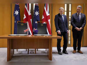 Australia's Deputy Prime Minister and Minister for Defence Richard Marles (R) and Britain's Secretary of State for Defence Grant Shapps take part in a signing ceremony at Parliament House in Canberra on March 21, 2024.