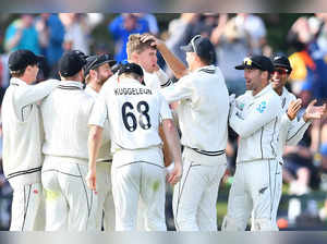 New Zealand's Ben Sears (C) is congratulated by teammates after taking the wicket of Australia's Marnus Labuschagne on day three of the second Test cricket match between New Zealand and Australia at Hagley Oval in Christchurch on March 10, 2024.