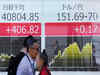 Japanese shares rise on weaker yen, demand for high-dividend stocks