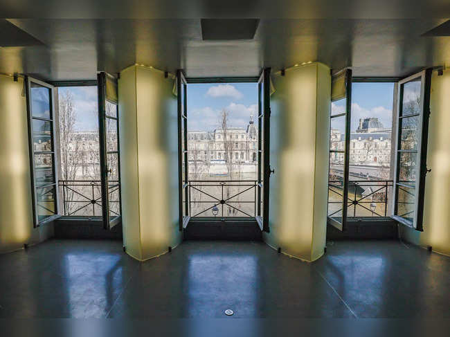 A photograph taken in Paris on March 7, 2024, shows part of the living room - with a view on the Louvre museum - of the futuristic 260 m2 three-room apartment with a 50 m2 dressing room which belonged to German fashion designer Karl Lagerfeld (1933-20219), who died in February 2019.
